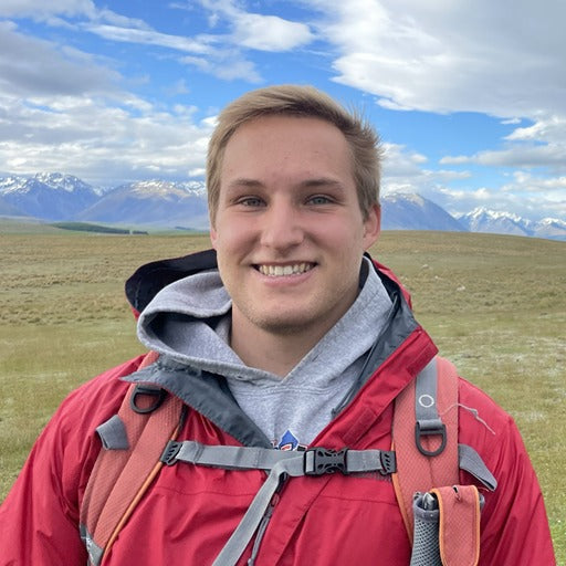 GrubTerra founder and CEO Michael Servais, smiling outdoors in a red jacket